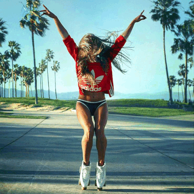 Animated, joyful rollerskaters outdoors.