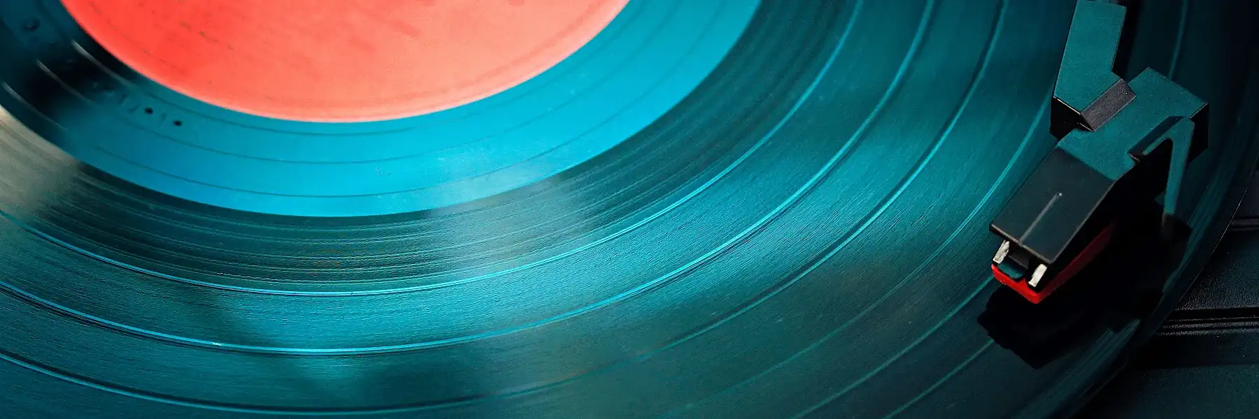 vinyl record album with red label and player needle